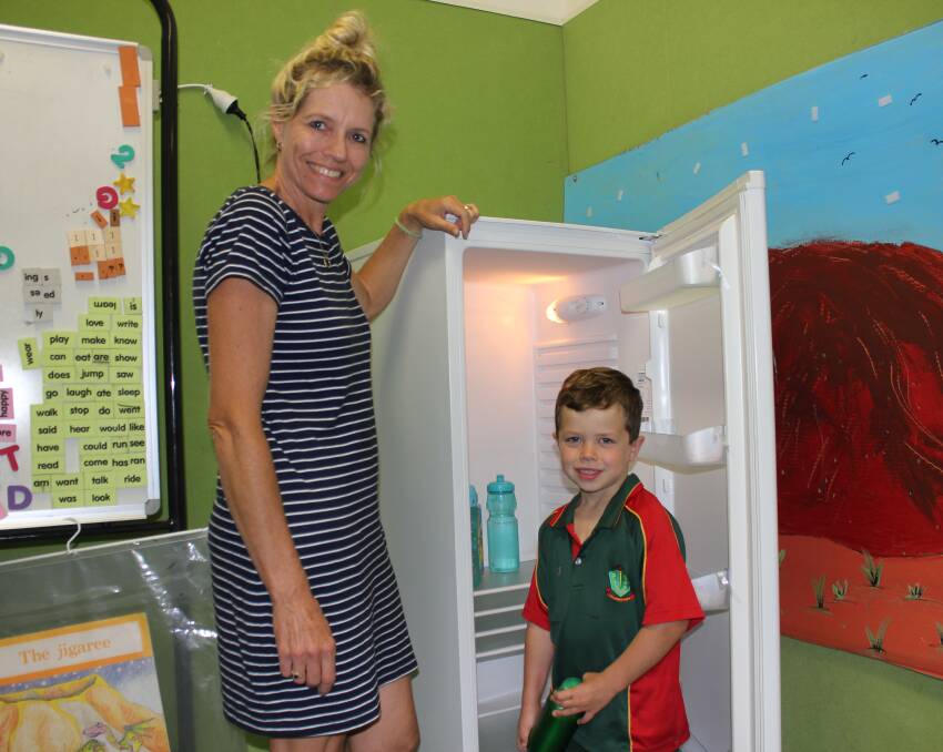 COOL: P and C Treasurer Kerrie Salter with her son Wil Salter aged 5 and one of the new refrigerators.