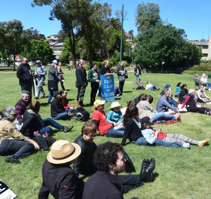 KEEP CALM: About 60 people turned out for Sunday's “Walk Together” rally in Newcastle's Civic Park to show their support for refugees. It was part of a national day of inter-faith demonstration. Picture: Tim Connell