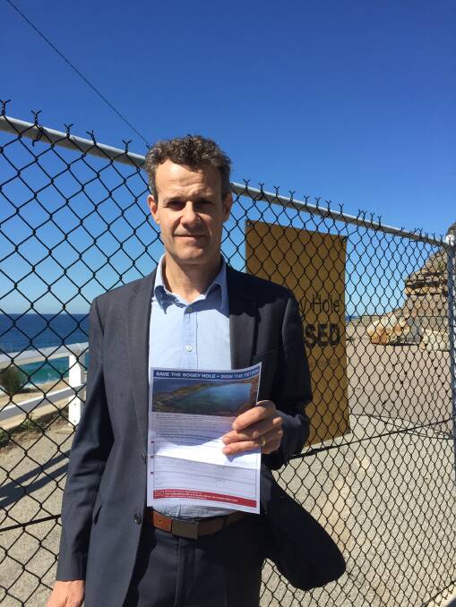 PETITION: Newcastle state Labor MP Tim Crakanthorp with a copy of the petition he intends mailing out to the Newcastle electorate, seeking 10,000 signatures to have the Bogey Hole debated in parliament.