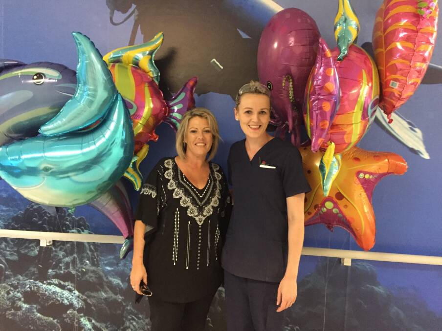 LIT UP: Examiner sales representative Tracey Marjoram with John Hunter Hospital nurse Elise Lane and some of the donated balloons.