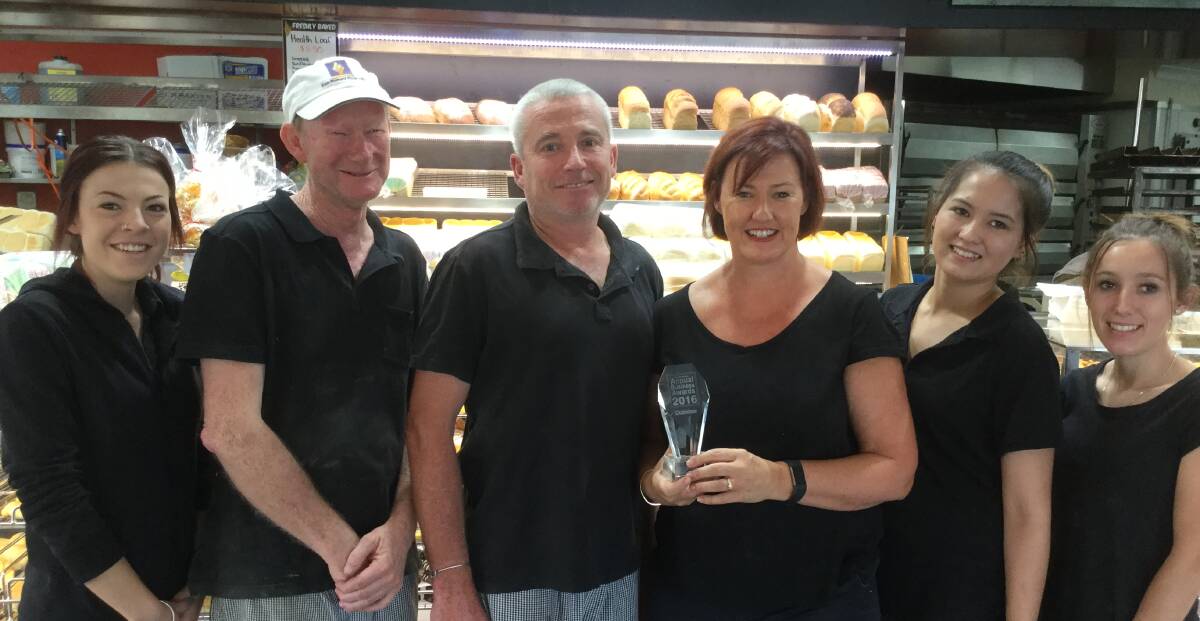 EXCITED: Saxby's Bakery and Cafe owners, Matthew and Sheree Lane, centre, pose with staff and their award.