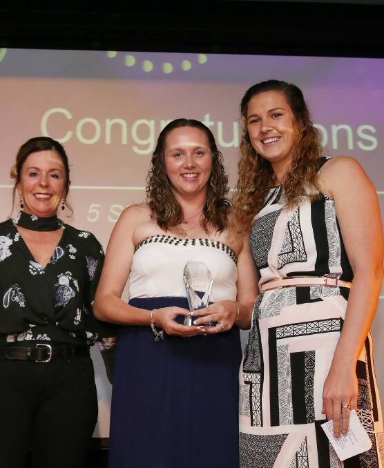 EXCITING: Port Stephens Family Day Care representatives Sarah McAllister, middle, and Melanie Coleman, right, with their award, presented by Vicki Ireland, left.