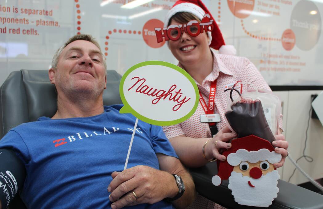 BLOOD: Erin Holford from Maitland Donor Centre with Aberglassyln donor Craig Ryan, getting off Santa’s naughty list by making a blood donation 