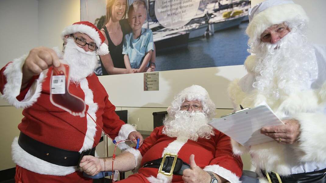 JOLLY GOOD FELLOWS: Santas Gary, Jeff and Ted from the Maitland Community Men’s Shed rolled up their sleeves in 2015 to donate blood ahead of the high-demand Christmas holiday period. Picture by PERRY DUFFIN