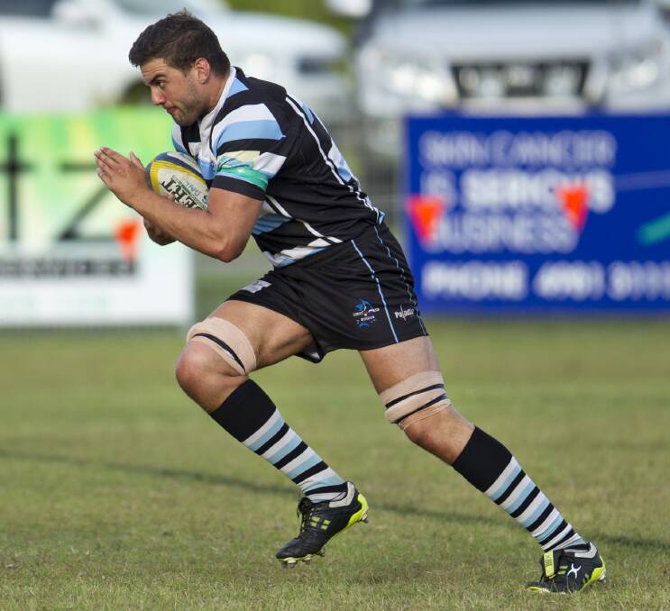 TROUBLE: Nelson Bay second-rower Brendan Haddad runs the ball up against Merewether on Saturday. Picture: Stewart Hazell