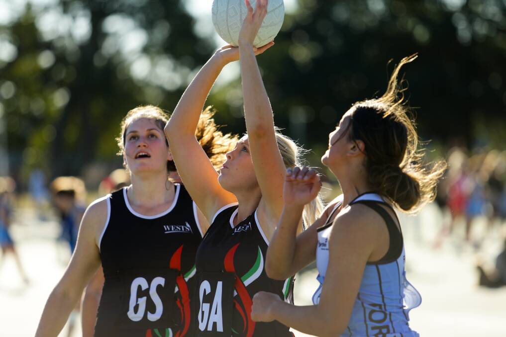 TOP SHOT: Wests' goal attack Emma Prince takes aim in the win over Forsythes. Picture: Jonathan Carroll