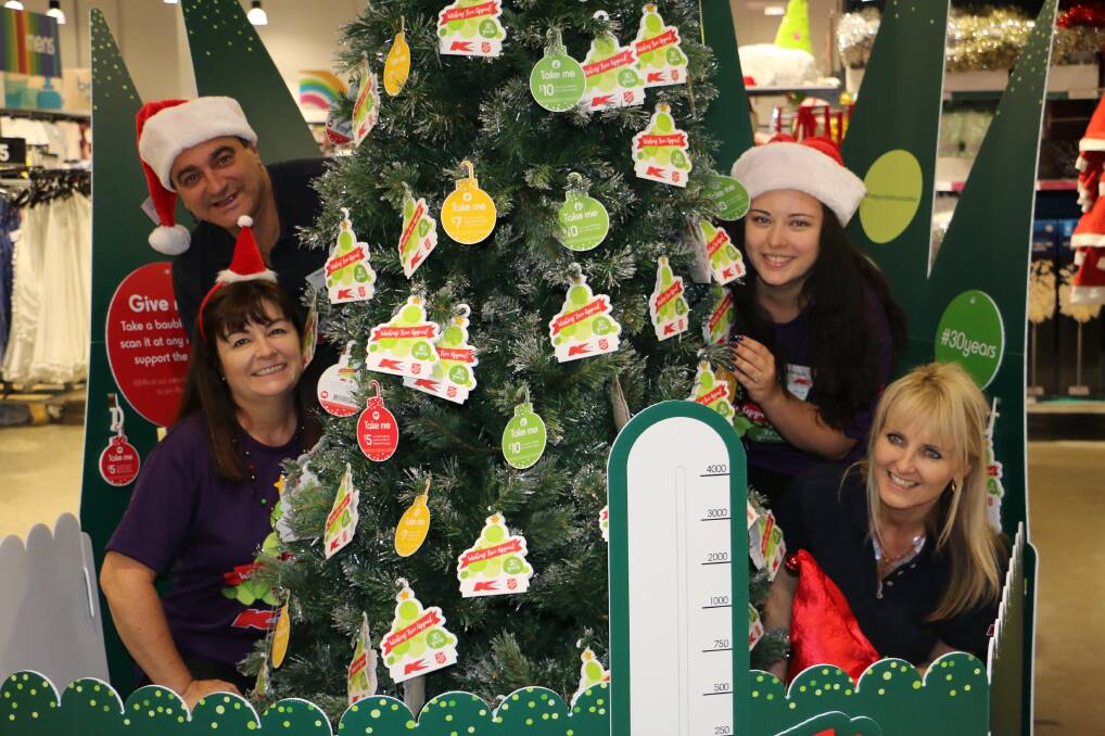 SPIRIT: Bec Martin, David Wright, Mikayla Martin and Donna Cornell hope Port residents will embrace the Kmart Wishing Tree appeal once again. Picture: Sam Norris
