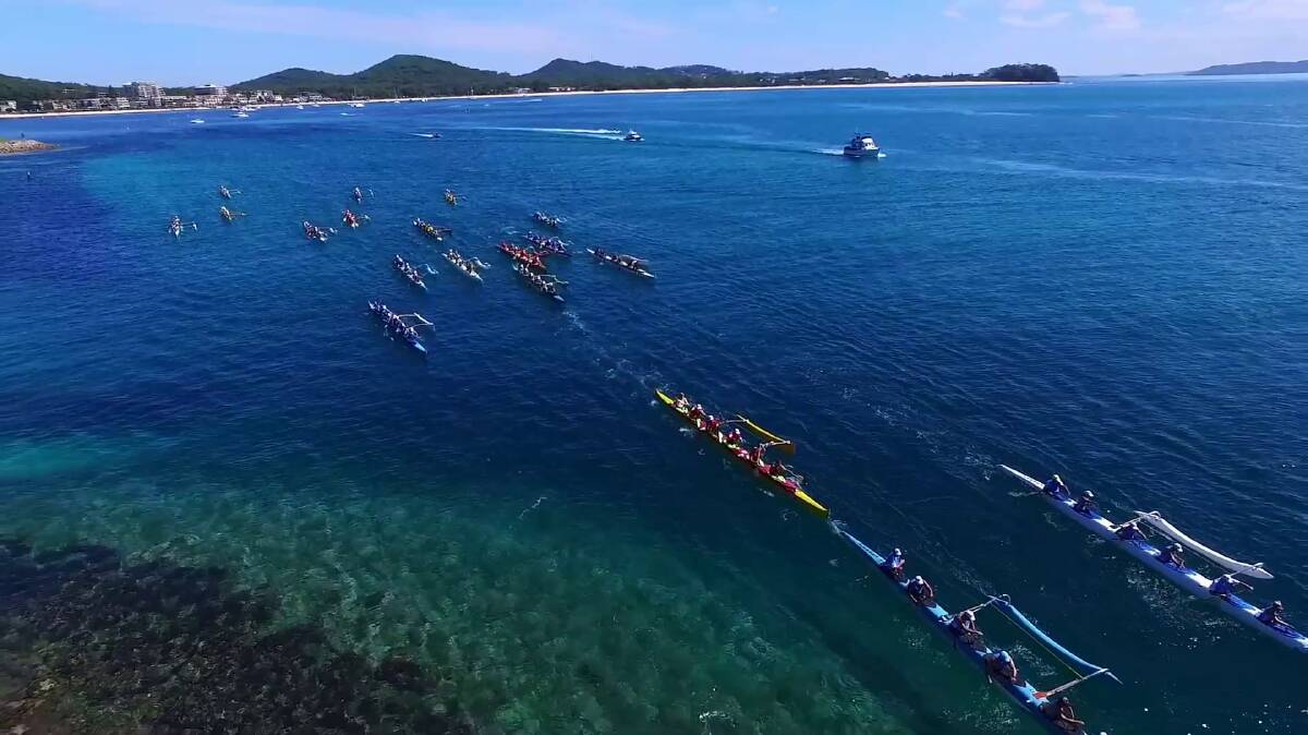 PICTURESQUE: Paddlers competing in the short course of the 2016 state title at Shoal Bay. The state titles return to Port Stephens in April. 