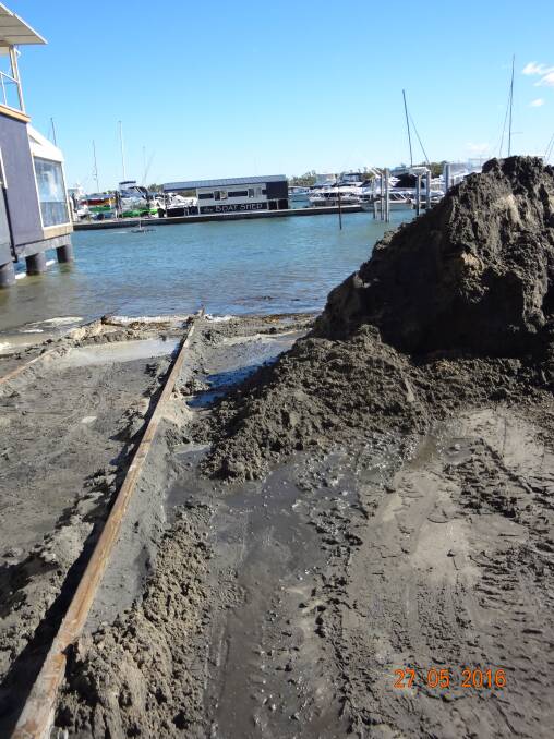 PENALTY: One fine was in relation to the dumping of dredged material onto a boat ramp which was observed spilling back into the marina waters. picture: Supplied