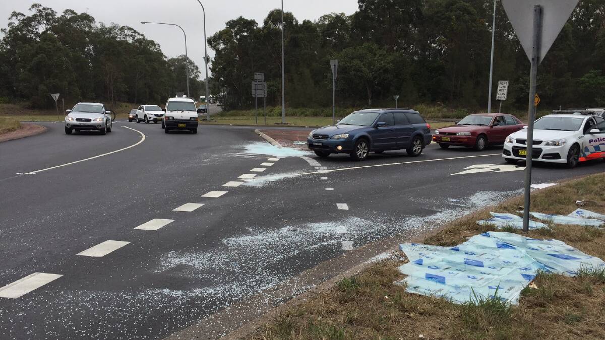 HAZARD: Glass on the road at the Pacific Highway roundabouts, Heatherbrae. Picture: Kia Woodmore