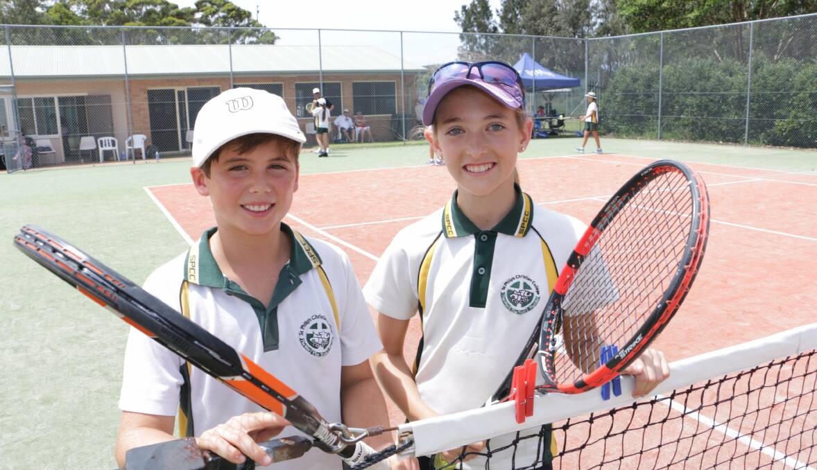 WINNERS ARE GRINNERS: Students Saskia Maurusha,11, and Oliver Custer,12,  from the winning St Philip's Christian College team at Fingal Bay. Picture: Stephen Wark
