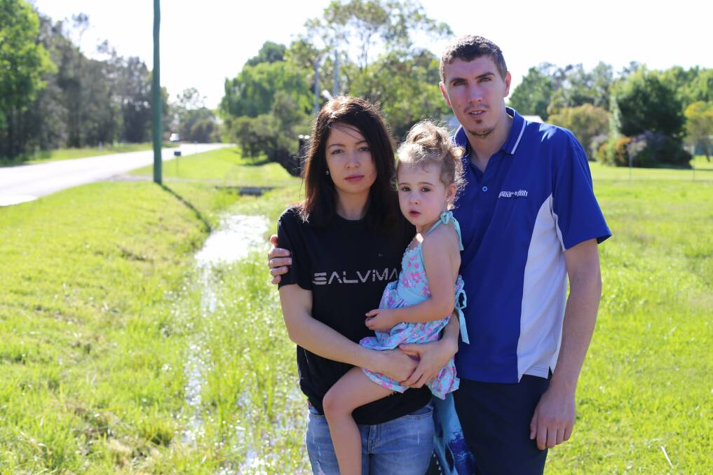 Jessica and Ryan Baker with their daughter Ociana outside their home in Salt Ash. Picture: Ellie-Marie Watts 