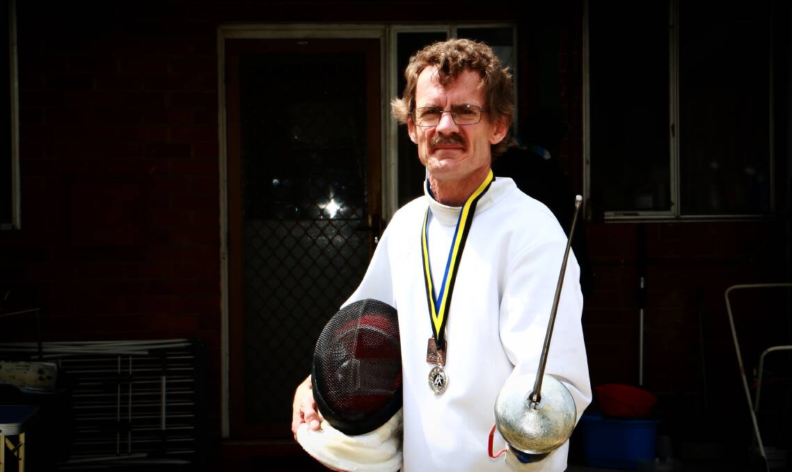 BATTLE-READY: Eddie Bridge, Raymond Terrace, has won silver and bronze medals against some fierce competitors in recent weeks as part of the Newcastle PCYC Fencing Club. Picture: Sam Norris