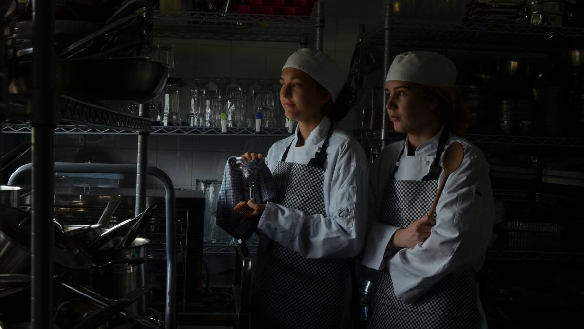DETERMINED: Year 12 Tomaree High School hospitality students Abby Mansfield and Olivia Duffy hope that good training, and experience like catering the Tastes at the Bay opening, will take them places. Picture: Sam Norris