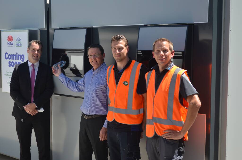 RECYCLE RIGHT: Port Stephens mayor Ryan Palmer and the Parliamentary Secretary for the Hunter Scot MacDonald MLC with the Tomra kiosk installers, Peter Maasdam of the Netherlands and Andreas Förster, Germany. Picture: Sam Norris