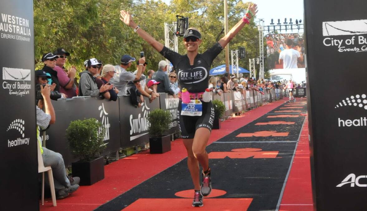 QUALIFIED: Krystle Hockley crosses the line second in her class at the Western Australian ironman to qualify for Hawaii. Picture: FinisherPix.com