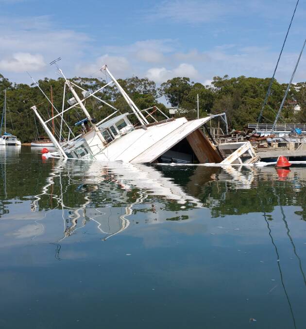 UNDERWATER: A 65-foot vessel at Albatross Marina sank in March spilling diesel on the water. Picture: Daniel McDonough