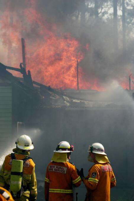 DANGER PERIOD: Bushfire claims a house on Brownes Road Salt Ash on October 1, 2007.