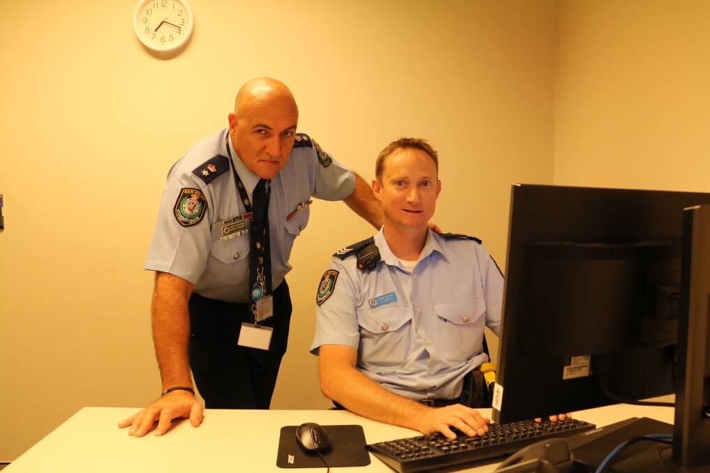 TIME: Detective Superintendent Wayne Humphrey will leave the Port Stephens command on Friday. He's pictured here with Acting Sergeant Duncan Arnold.