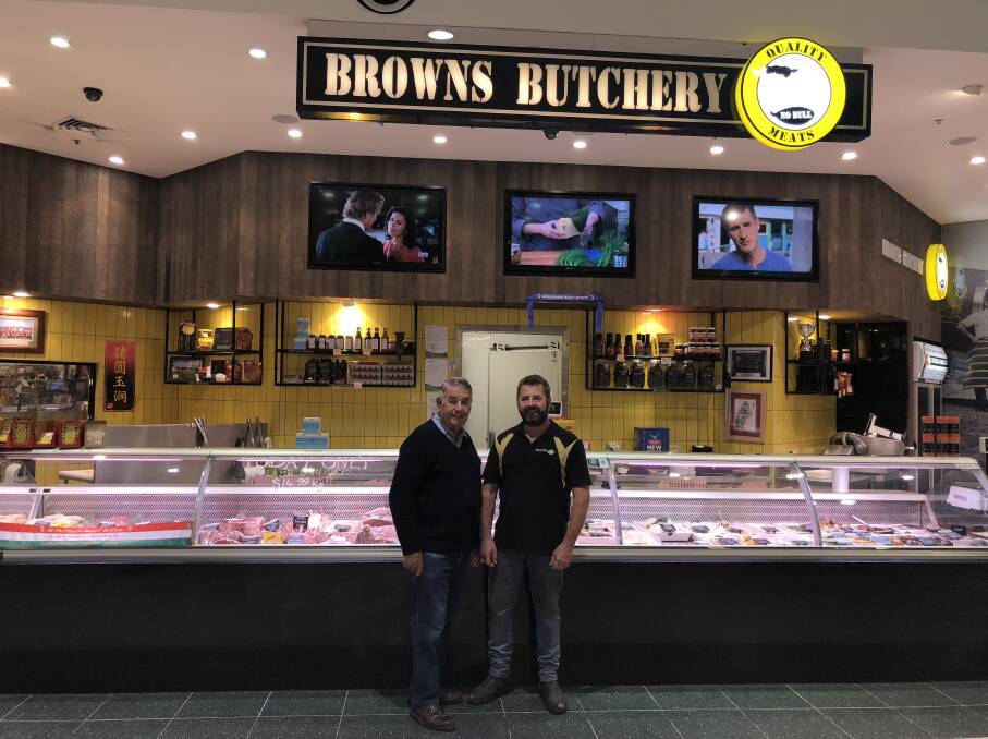 PROUD BEGINNINGS: Warren and Tim Brown outside the Raymond Terrace store this week. Picture: Supplied