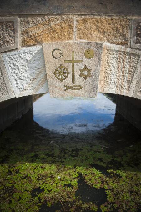 UNITY: The keystone and its brass-inlaid religious symbols. Picture: Perry Duffin