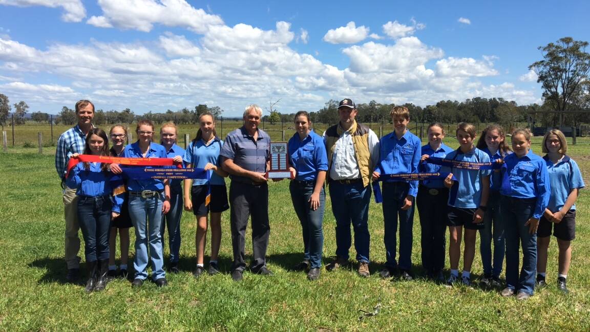 CHAMPIONS: Tocal education officer Bruce West hands the steers schools challenge trophy to Hunter River High student and cattle team show captain Abbey McDonald. Castlereagh Feed representative David Kelly (right) was also in attendance. Picture: Supplied.