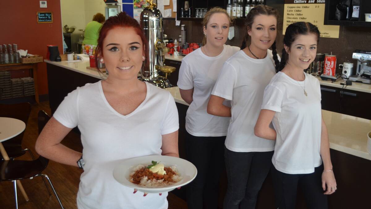 FOOD'S UP: Emma Hankinson, 15, ready to serve up some chilli con carne at Milo's Table with Amy Cottam, 15, Terri Burns, 15, and Chelsea Peterson, 15. Picture: Sam Norris