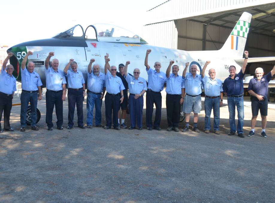 TEAM EFFORT: The volunteers from Williamtown Fighter World who spent three years on the Sabre's restoration.