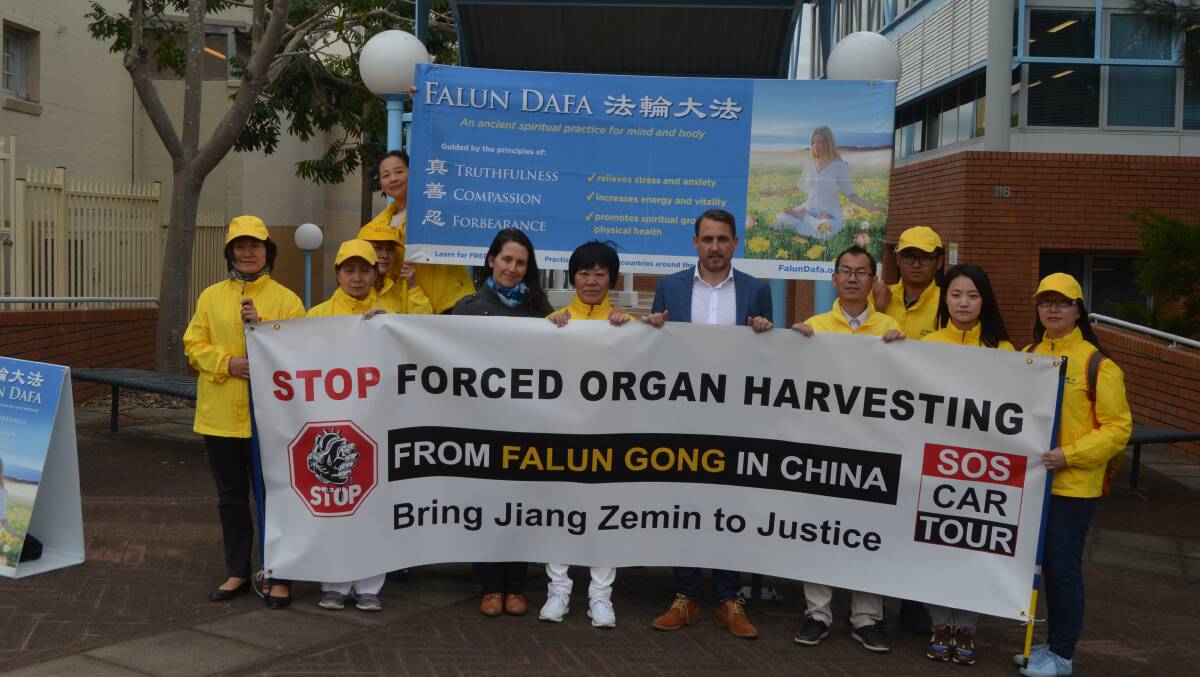 PEACEFUL: Australian members of the Falun Gong gathered outside Port Stephens Council on Friday.