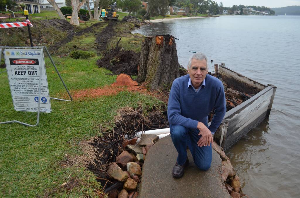 HIGH TIME: Cr John Nell said work on a replacement sea wall at Kangaroo Point was well due. A remnant of the old timber sleeper-style wall was all that was left on Wednesday. Picture: Sam Norris