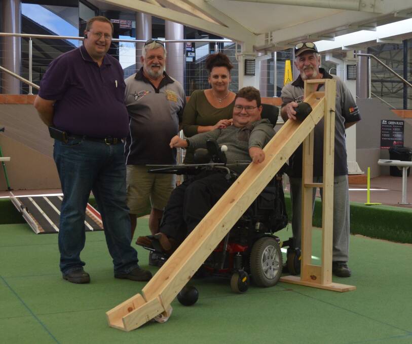 HERE TO HELP: Ben Hellyer has received a little help to bowl from Multi-Bowls organiser Adam Nicholas, Men's Shed  secretary-treasurer Frank Seysener, nurse-carer Cyndy Gam, and Lloyd Mitchell (Men's Shed). Picture: Sam Norris