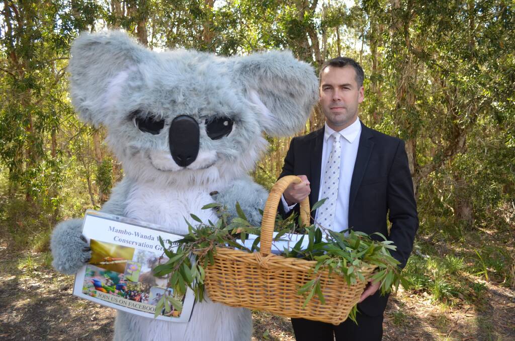 SOFTLY SOFTLY: The mascot for Mambo-Wanda Wetlands Conservation Group presents mayor Ryan Palmer with the petitions. Picture: Sam Norris