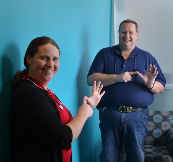 SIGN LANGUAGE: Speech pathologist Aimee Robinson will deliver a basic sign language workshop at Riverside Fiesta. She's pictured with organiser Adam Nicholas.