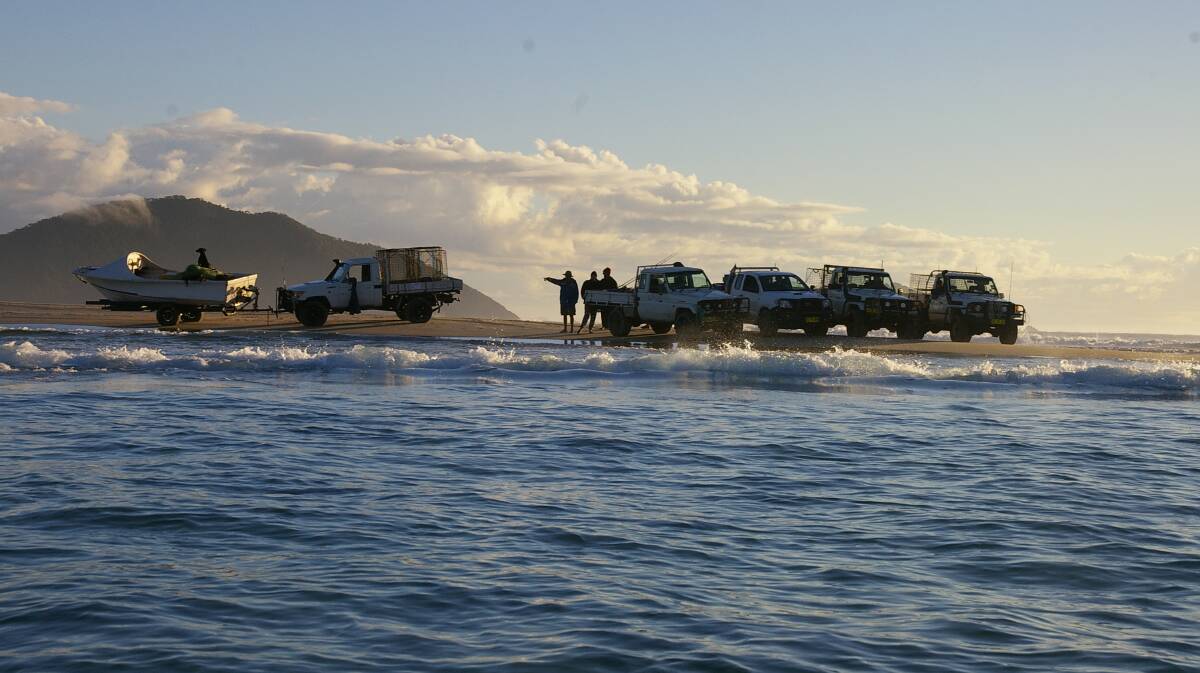 BIG INTEREST: Commercial fishermen on Fingal Beach. Photo: Rick Haughton