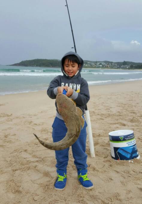 MASSIVE EFFORT: Young Sam Viles with his mighty Fingal Bay flathead.