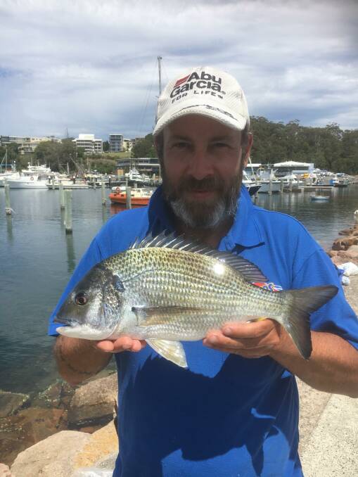 USE YOUR LOAF: Dean Bird at the marina with his 42cm bread-eating bream.