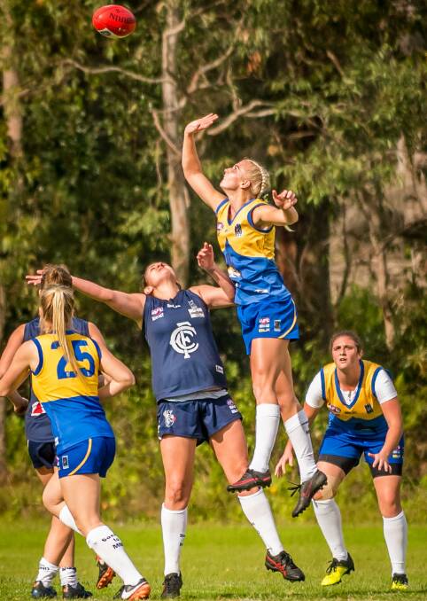 Nelson Bay ruckman Pippa Smyth playing against Newcastle City last month. The two sides meet in the grand final rematch on Saturday evening. Picture: Ken Logan