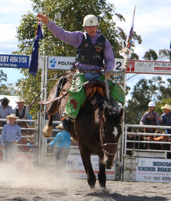 RIDE 'EM!: Henry Elliott on a bucking bronco at the Stroud Rodeo on the weekend. More than 1000 riders tested their mettle in campdraft and rodeo categories. Picture: Hannah Baldwin.