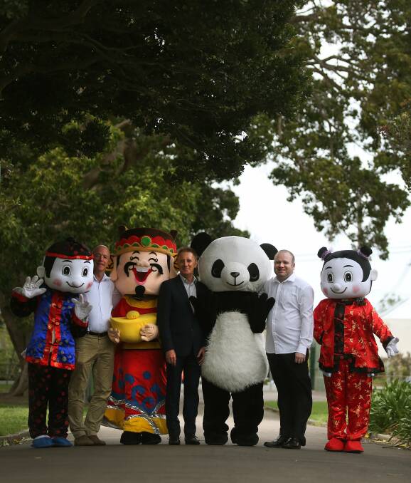 Park economy: Council economic development coordinator Greg Fenwick, Confucius Institute director Rhys Palmer and Hamilton Chamber of Commerce president Nathan Errington with Chinese mascots. Picture: Marina Neil. 