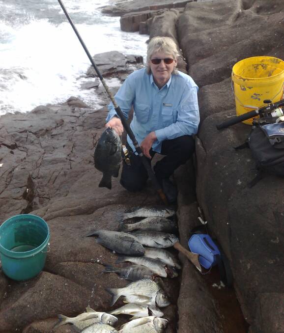 KEEP IT SAFE: Experienced rock fisher Wayne Coles with a mixed bag of catches. 