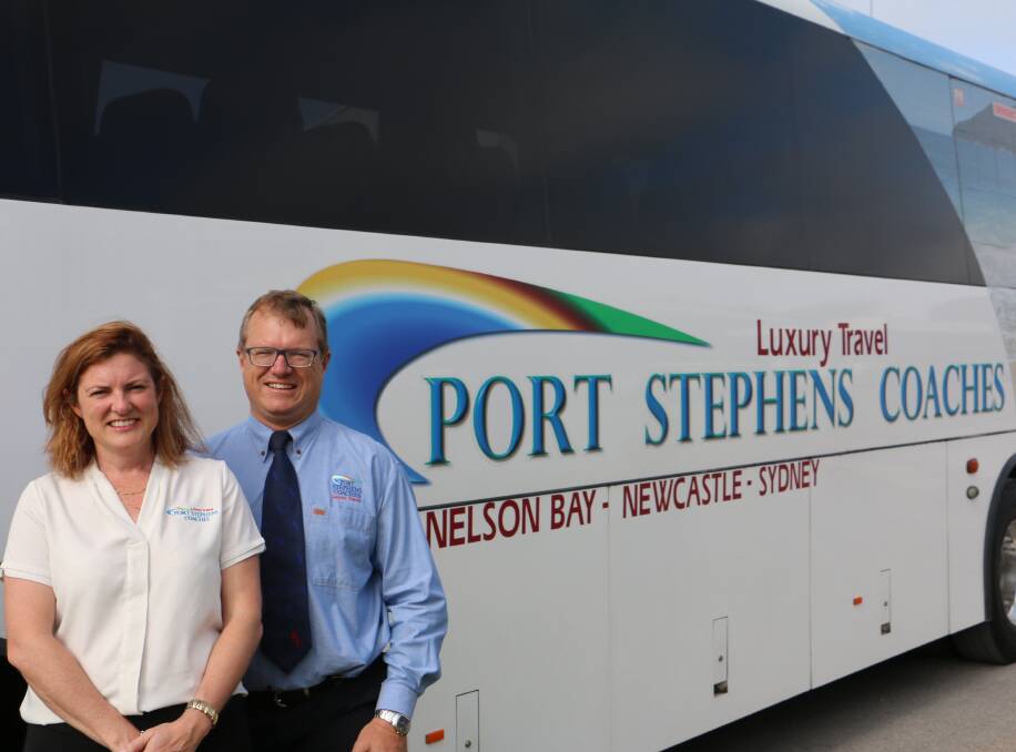 SMILES ALL ROUND: Brother and sister Alison Schneeberger and Chris Fogg are third generation owners of Port Stephens Coaches.