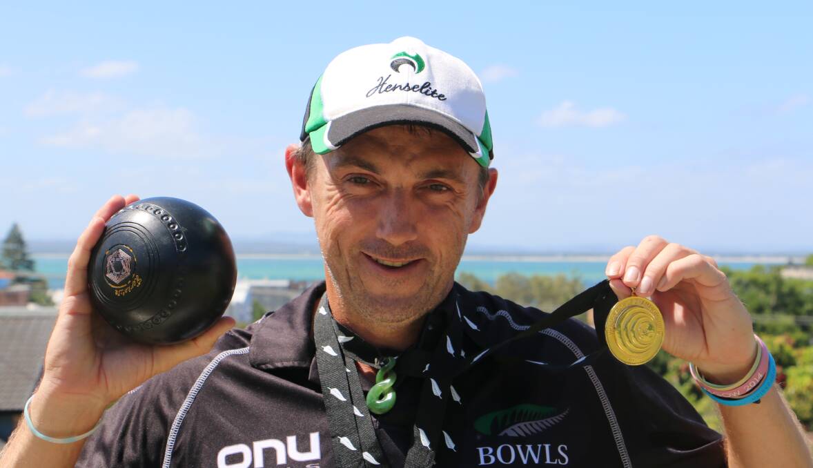 WORLD CHAMP: Blake Signal, Nelson Bay, holds the gold medal he recently won for New Zealand at the World Bowls Championship in Christchurch, NZ. Picture: Kia Woodmore