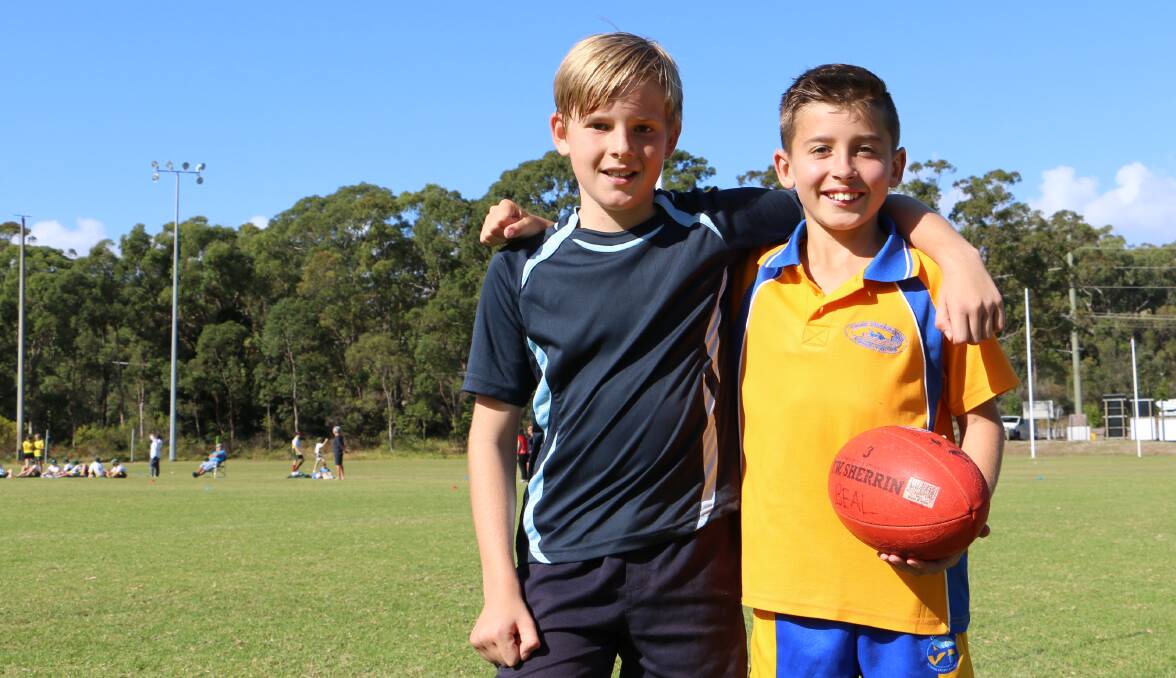 YOUNG TALENT: Jack Denahy, 10, and Hugh Doherty, 11, have been picked for the Hunter Wolves in the NSW PSSA AFL Championships, which will be held in Nelson Bay. Picture: Ellie-Marie Watts