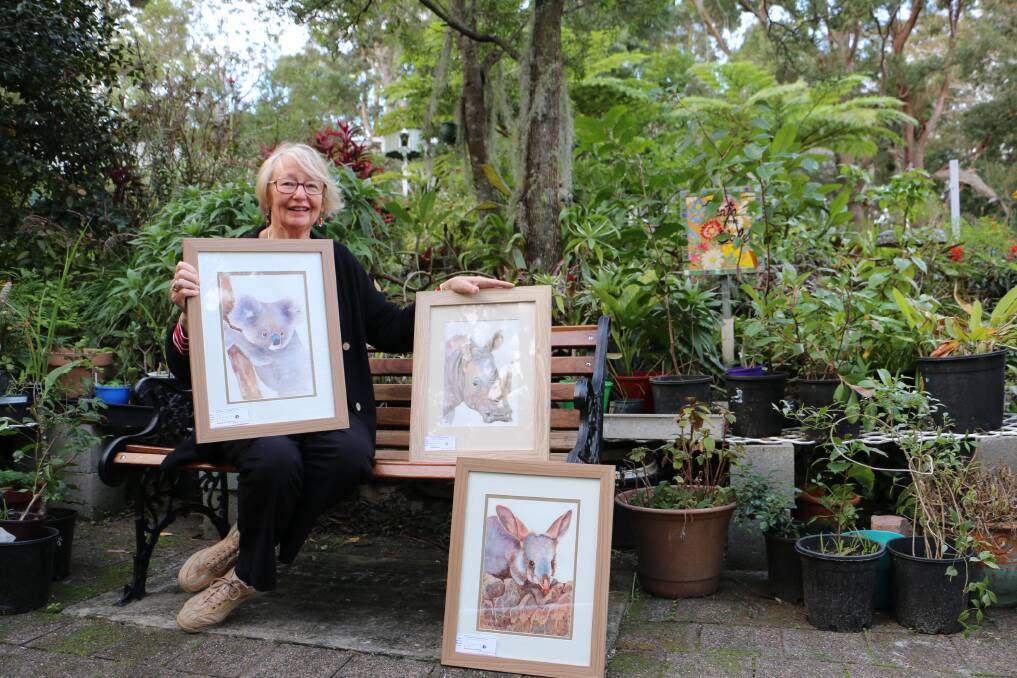 PRESERVATION: Port Stephens Community Arts Centre member and artist Nada O’Loughlin with some of the paintings that will be shown in Our Threatened Species exhibition. Picture: Ellie-Marie Watts