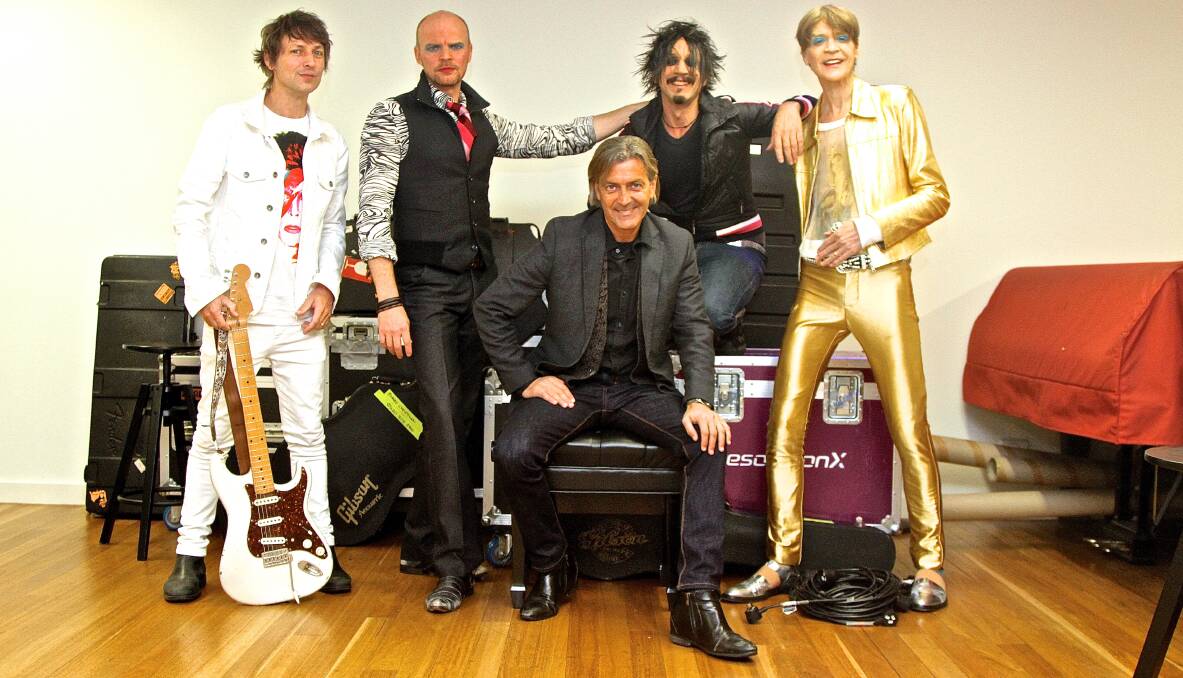 STAR MEN: Jak Housden (back), musical director of the Bowie rock symphony, with Brydon Stace, Steve Balbi and Jeff Duff from Ziggy – Songs of David Bowie with (front) conductor George Ellis.