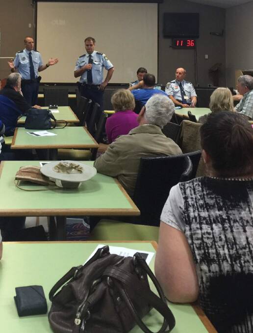 ENGAGED: Port Stephens police commander, Superintendent Chris Craner (left), speaks to Tilligerry Peninsula residents about policing concerns in the area.