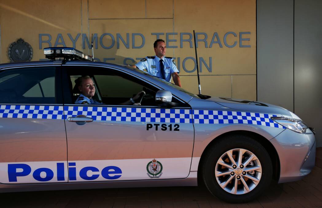 TRIBUTE: Superintendent Chris Craner and Sergeant Martine Morley with the new Port Stephens police car, which is dedicated to Geoffrey Richardson who died in the line of duty in March. Picture: Simone De Peak