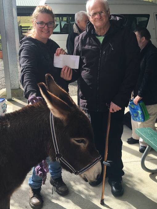 HELP: Erin Saunders from the Good Samaritan Donkey Sanctuary and Warwick Rumble from Lifestyle Solutions. Picture: Supplied