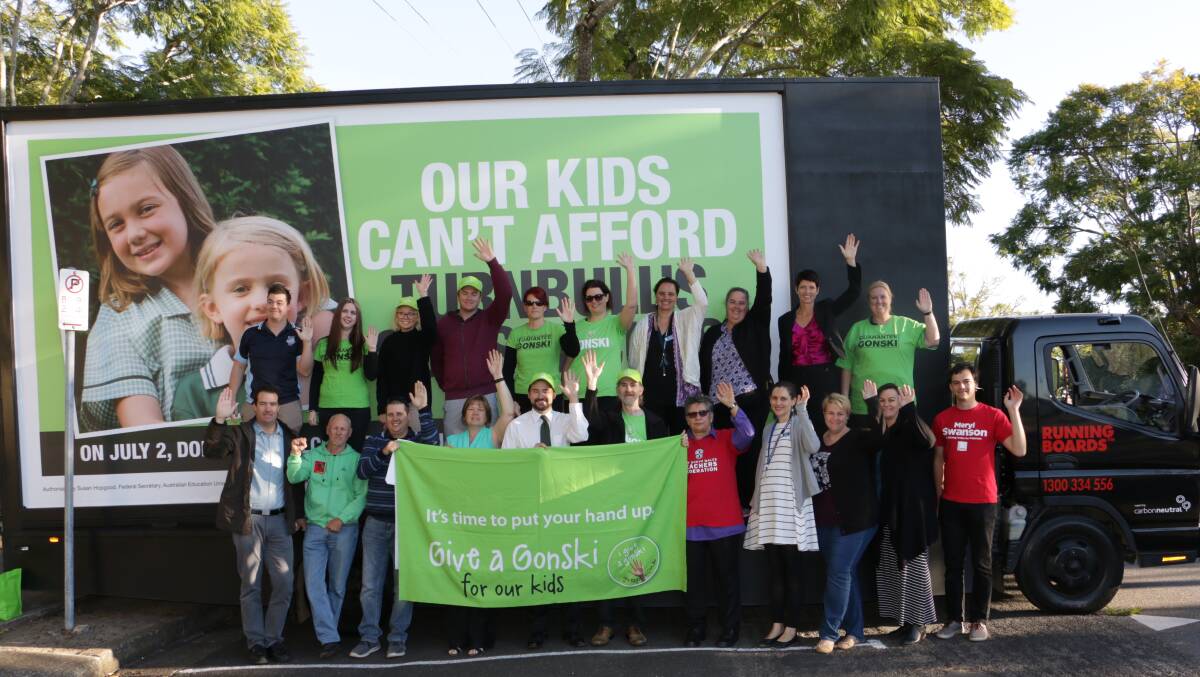 GIVE A GONSKI: Port Stephens teachers were amongst a group of people who showed they 'give a Gonksi' outside Raymond Terrace Public School on Tuesday morning.