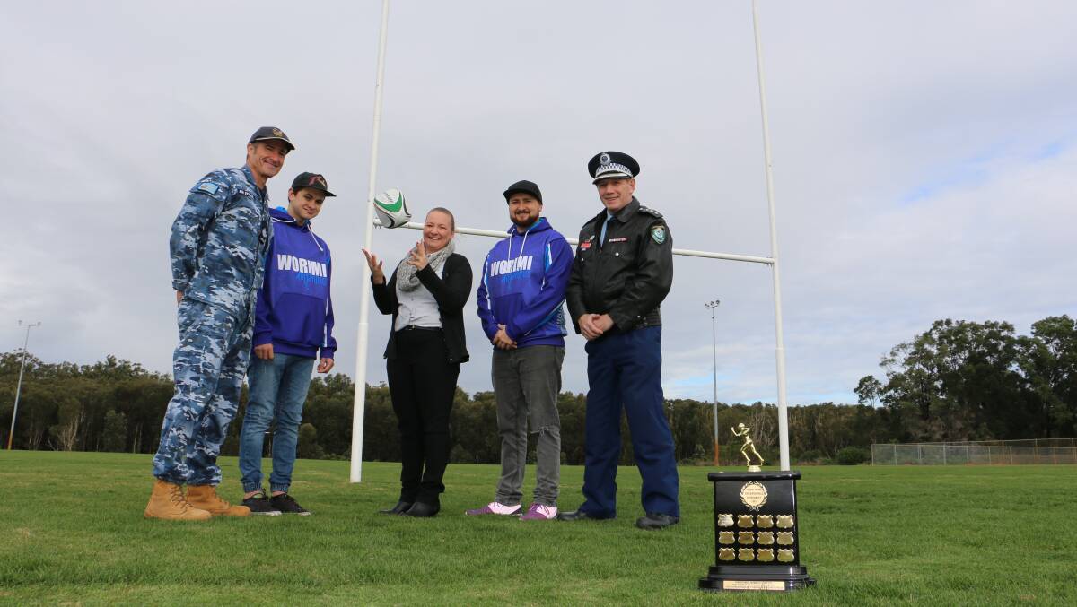 CLOSE CONTEST: RAAF Base Williamtown Warrant Officer Brett Davis, Brady Ridgeway, Cindy Vasconcelos from Port Stephens Council, Jacob Ridgeway and Port Stephens police Inspector Tony Townsend at Lakeside Sports Complex where the Port Stephens NAIDOC Touch Championship will be held. Picture: Ellie-Marie Watts 